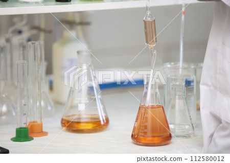 Laboratory with glass test tubes for alcoholic beverages. Laboratory with glass test tubes for alcoholic beverages. 112580012
