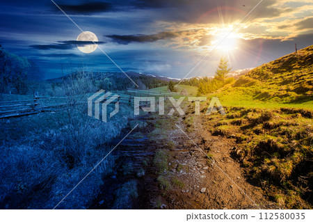 carpathian countryside scenery on spring equinox. mountainous rural landscape beneath a sky with sun and moon. day and night time change concept 112580035