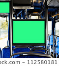 information board in the bus cabin. selective focus. advertising in public transport. screen on the bus, a place for advertising. 112580181