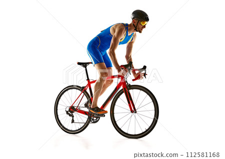 Athletic young man, cyclist in uniform, helmet and goggles in motion, riding bike isolated on white studio background 112581168