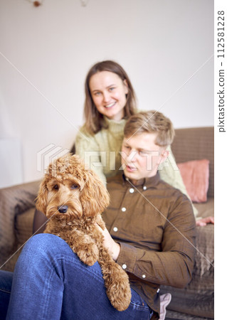 cockapoo in the hands of parents cockapoo in the hands of parents 112581228