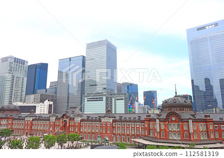 Scenery of Tokyo Station in Chiyoda-ku, Tokyo, among many skyscrapers 112581319