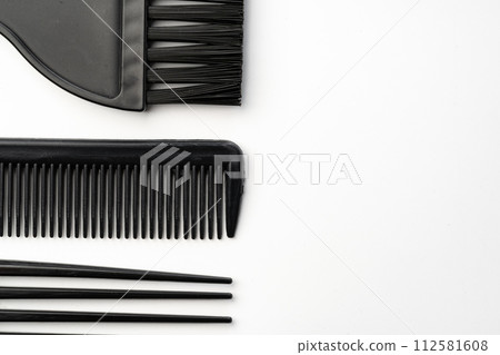 Black plastic hair comb isolated on white background Black plastic hair comb isolated on white background 112581608
