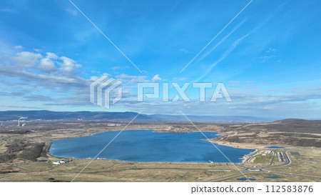 Lake Most lignite coal brown anthropogenic pond water created result reclamation former territory drone aerial Stary Most district city Ustecky Region, mine recreational tourist travel Europe 112583876