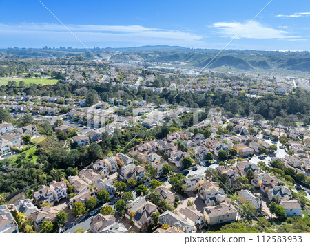 Aerial view of middle class subdivision neighborhood with residential houses in San Diego, California, USA. Aerial view of middle class subdivision neighborhood with residential houses in San Diego, California, USA. 112583933
