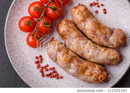 Grilled sausages with spices and herbs. With copy space Grilled sausages with spices and herbs. With copy space 112585163