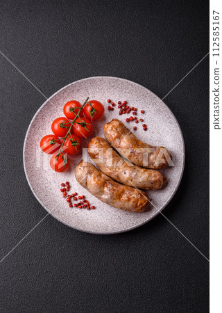 Grilled sausages with spices and herbs. With copy space 112585167