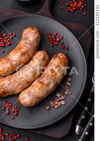 Grilled sausages with spices and herbs. With copy space 112585181