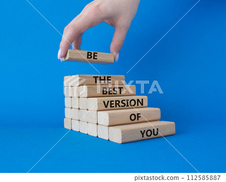 Be the best version of you symbol. Concept words Be the best version of you on wooden blocks. Businessman hand. Beautiful blue background. Business concept. Copy space. Be the best version of you symbol. Concept words Be the best version of you on wooden blocks. Businessman hand. Beautiful blue background. Business concept. Copy space. 112585887