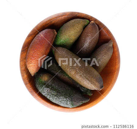 Fresh finger limes in wooden bowl isolated on white background. Caviar lime. Fruits pods. Top view. Fresh finger limes in wooden bowl isolated on white background. Caviar lime. Fruits pods. Top view. 112586116