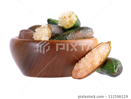 Fresh finger limes in wooden bowl isolated on white background. Caviar lime. Fruits pods. 112586129