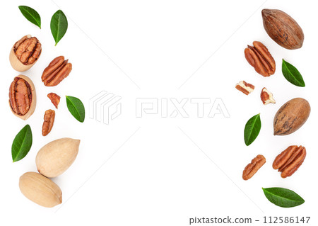 pecan nut decorated with green leaves isolated on white background. Top view. Flat lay 112586147