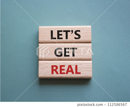 Lets get real symbol. Concept words Lets get real on wooden blocks. Beautiful grey green background. Business and Lets get real concept. Copy space. 112586567
