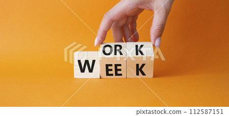 Work Week symbol. Businessman hand Turns cubes with words Work Week. Beautiful orange background. Business and Work Week concept. Copy space Work Week symbol. Businessman hand Turns cubes with words Work Week. Beautiful orange background. Business and Work Week concept. Copy space 112587151