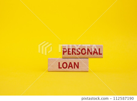 Personal Loan symbol. Concept word Personal Loan on wooden blocks. Beautiful yellow background. Business and Personal Loan concept. Copy space 112587190