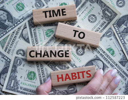 Time to Change Habits symbol. Wooden blocks with words Time to Change Habits. Beautiful dollar background. Psychologist hand. Psychology and Time to Change Habits concept. Copy space. Time to Change Habits symbol. Wooden blocks with words Time to Change Habits. Beautiful dollar background. Psychologist hand. Psychology and Time to Change Habits concept. Copy space. 112587223
