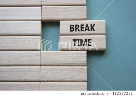 Break Time symbol. Concept word Break Time on wooden blocks. Beautiful grey green background. Business and Break Time concept. Copy space Break Time symbol. Concept word Break Time on wooden blocks. Beautiful grey green background. Business and Break Time concept. Copy space 112587231
