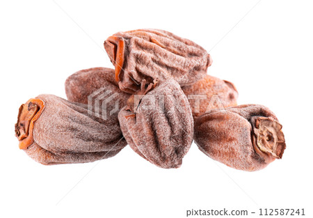 Dried persimmon isolated on white background. Dried fruit snack. Dried persimmon isolated on white background. Dried fruit snack. 112587241