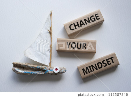 Change your mindset symbol. Concept words Change your mindset on wooden blocks. Beautiful white background with boat. Business and Change your mindset concept. Copy space. 112587246
