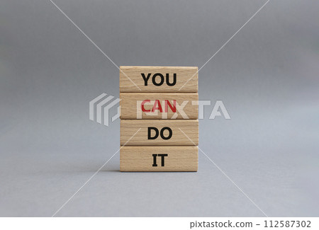 You can do it symbol. Concept words You can do it on wooden blocks. Beautiful grey background. Business and You can do it concept. Copy space. You can do it symbol. Concept words You can do it on wooden blocks. Beautiful grey background. Business and You can do it concept. Copy space. 112587302
