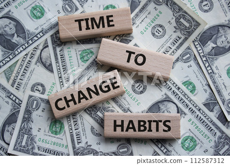 Time to Change Habits symbol. Wooden blocks with words Time to Change Habits. Beautiful dollar background. Psychology and Time to Change Habits concept. Copy space. Time to Change Habits symbol. Wooden blocks with words Time to Change Habits. Beautiful dollar background. Psychology and Time to Change Habits concept. Copy space. 112587312