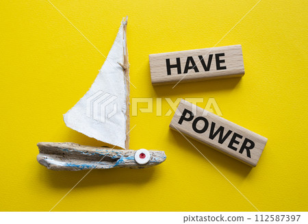 Have power symbol. Wooden blocks with words have power. Beautiful yellow background with boat. Business and have power concept. Copy space. 112587397