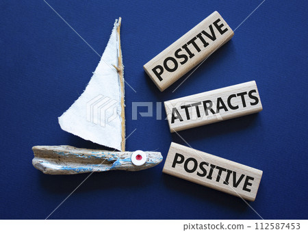 Positive attracts Positive symbol. Wooden blocks with words Positive attracts Positive. Beautiful deep blue background with boat. Business and Positive attracts Positive concept. Copy space. Positive attracts Positive symbol. Wooden blocks with words Positive attracts Positive. Beautiful deep blue background with boat. Business and Positive attracts Positive concept. Copy space. 112587453