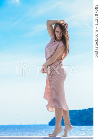 Woman in long romantic dress elegant dress Woman in long romantic dress elegant dress 112587685