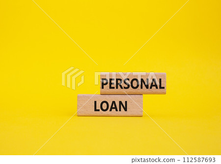 Personal Loan symbol. Concept word Personal Loan on wooden blocks. Beautiful yellow background. Business and Personal Loan concept. Copy space Personal Loan symbol. Concept word Personal Loan on wooden blocks. Beautiful yellow background. Business and Personal Loan concept. Copy space 112587693