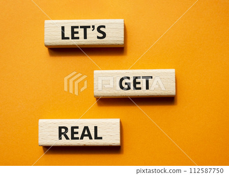 Lets get real symbol. Concept words Lets get real on wooden blocks. Beautiful orange background. Business and Lets get real concept. Copy space. Lets get real symbol. Concept words Lets get real on wooden blocks. Beautiful orange background. Business and Lets get real concept. Copy space. 112587750