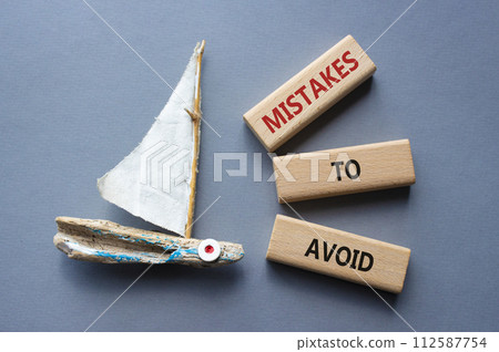 Mistakes to Avoid symbol. Wooden blocks with words Mistakes to Avoid. Beautiful grey background with boat. Business and Mistakes to Avoid concept. Copy space. Mistakes to Avoid symbol. Wooden blocks with words Mistakes to Avoid. Beautiful grey background with boat. Business and Mistakes to Avoid concept. Copy space. 112587754