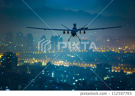 AI-generated content. Military unmanned airplane soaring over city lights during the night. 112587765
