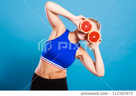 Woman holding grapefruit citrus fruit in hands Woman holding grapefruit citrus fruit in hands 112587973