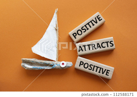 Positive attracts Positive symbol. Wooden blocks with words Positive attracts Positive. Beautiful orange background with boat. Business and Positive attracts Positive concept. Copy space. Positive attracts Positive symbol. Wooden blocks with words Positive attracts Positive. Beautiful orange background with boat. Business and Positive attracts Positive concept. Copy space. 112588171