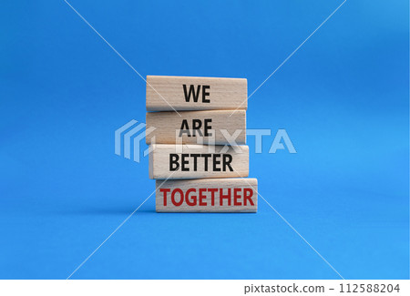 We are better together symbol. Wooden blocks with words We are better together. Beautiful blue background. We are better together concept. Copy space. We are better together symbol. Wooden blocks with words We are better together. Beautiful blue background. We are better together concept. Copy space. 112588204