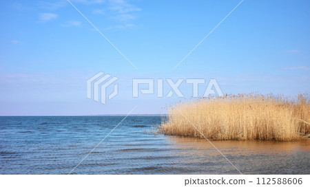 Peaceful landscape of the Szczecin Lagoon in the Oder estuary, shared by Germany and Poland. Peaceful landscape of the Szczecin Lagoon in the Oder estuary, shared by Germany and Poland. 112588606