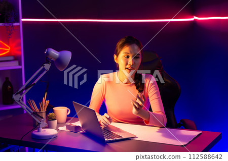 Smiling Asian influencer talking in positive podcast live on social. Stratagem. Smiling Asian influencer talking in positive podcast live on social. Stratagem. 112588642