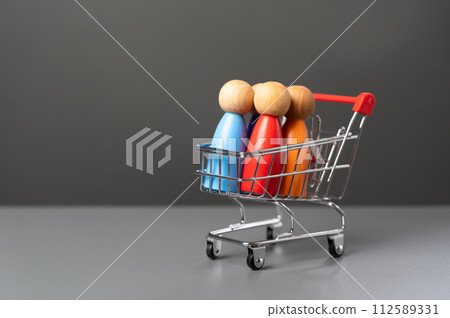 People in a shopping cart. Marketing, consumerism. Human trafficking. Products and marketing strategies. Buyer preferences. Customers People in a shopping cart. Marketing, consumerism. Human trafficking. Products and marketing strategies. Buyer preferences. Customers 112589331