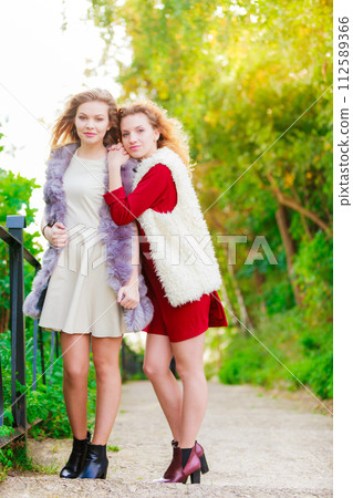 Two fashionable women outdoor 112589366