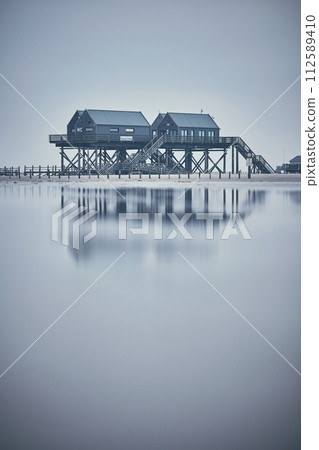stilt house at sankt peter-ording germany 112589410
