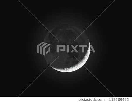 Crescent Moon in night sky 112589425