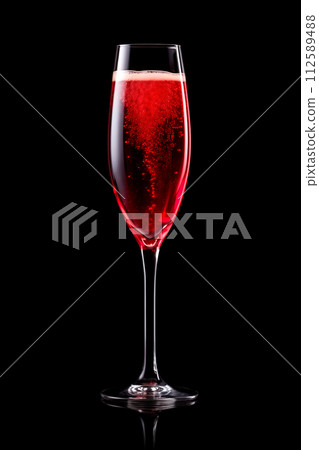 Set of crystal-clear flute glass of champagne isolated on black background 112589488