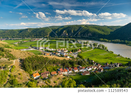 Panorama of Wachau valley with Danube river near Duernstein village in Lower Austria. Traditional wine and tourism region, Danube cruises. Panorama of Wachau valley with Danube river near Duernstein village in Lower Austria. Traditional wine and tourism region, Danube cruises. 112589543