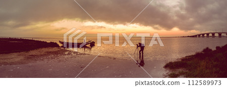 Photographer in action 112589973