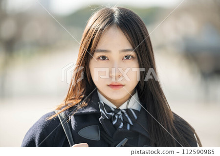 A female high school student looking intently at the future 112590985