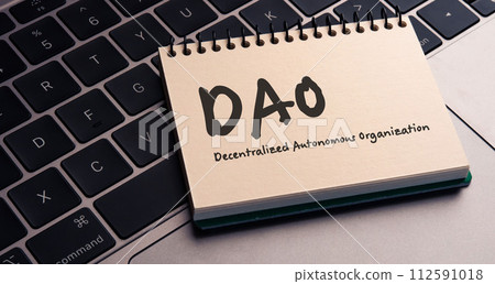 I have a notepad on my laptop that has the words decentralized autonomous organization on it. It's an eye-catching image. I have a notepad on my laptop that has the words decentralized autonomous organization on it. It's an eye-catching image. 112591018