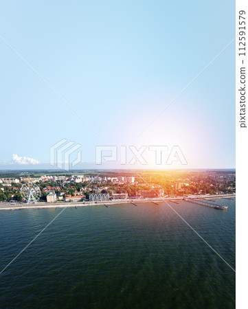 Baltic sea beach with Zelenogradsk embankment. Kaliningrad region. Aerial view. Suset time 112591579