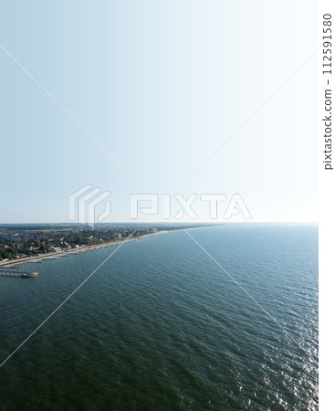 Baltic sea beach with Zelenogradsk embankment. Kaliningrad region. Aerial view. Suset time 112591580