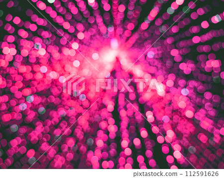 Blurred pink christmas tree with lights. Blur balls bokeh background 112591626