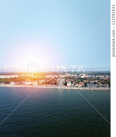 Baltic sea beach with Zelenogradsk embankment. Kaliningrad region. Aerial view.  Suset time 112591631